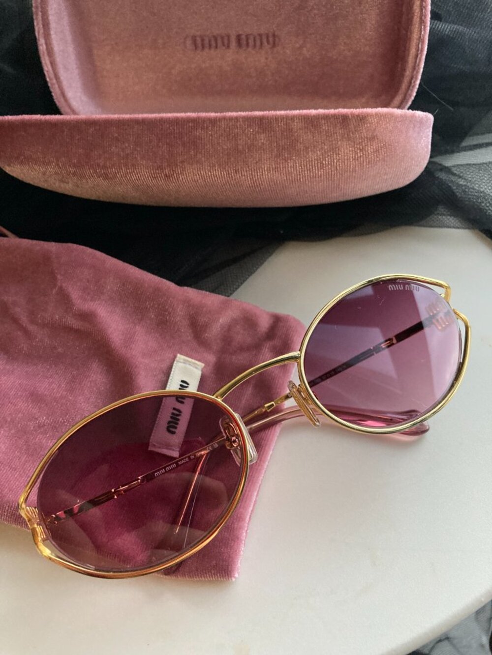 Miu Miu Gold Frame Sunglasses with Purple Lenses